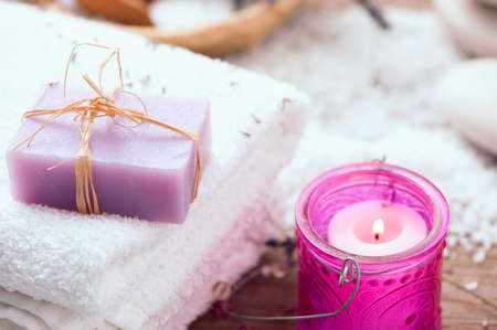 Lavender handmade soap bars, candel on wooden background. Selective focus