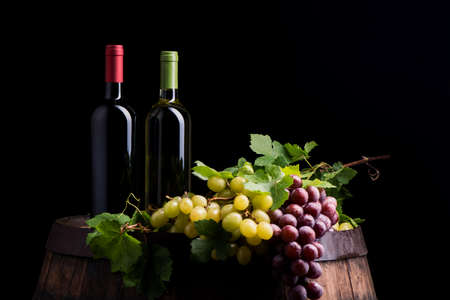 Two bottles of wine on dark backgroundの写真素材