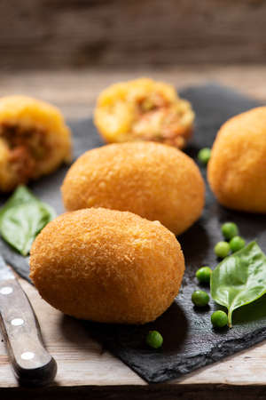 selction of arancini di riso, fried risotto rice balls, italian sicilian food on a plateの写真素材
