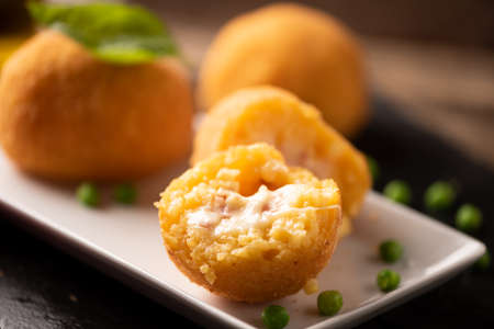 selction of arancini di riso, fried risotto rice balls, italian sicilian food on a plateの写真素材