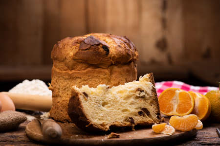Italian Christmas cake on wooden table. Homemade Panettone