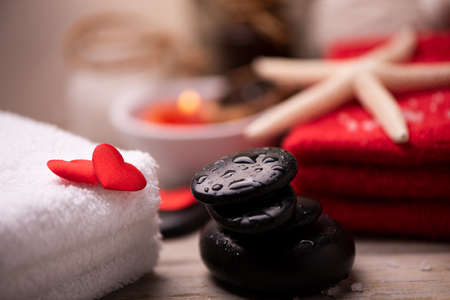 Wellness docoration on valentine's day with candels and stonesの写真素材