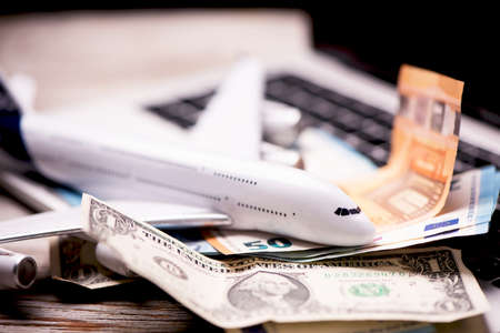Aircraft banknotes on a notebook. Travelling conceptの写真素材