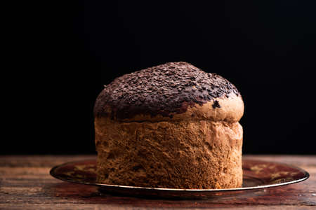 Choccolate panettone on a rustic tableの写真素材