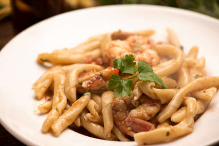 Delicious home made pasta with shrimps. Sicily food on white plateの写真素材