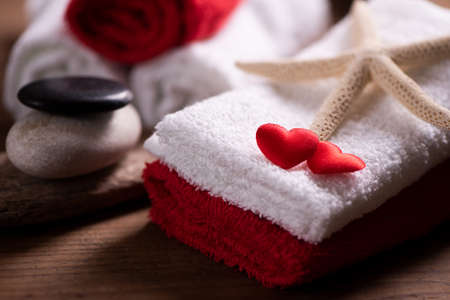 Wellness docoration on valentine's day with towels and stonesの写真素材