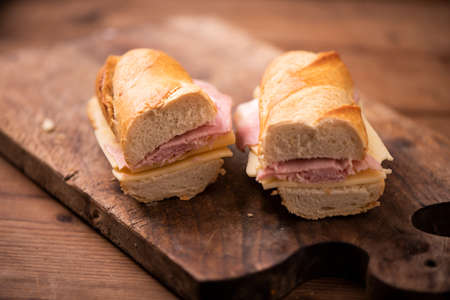 baguette sandwiches on rustic table close upの写真素材