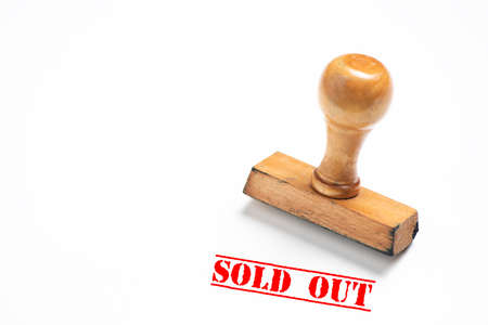Rubber stamp with sold out sign on whiteの写真素材