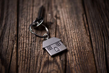 House key ring and old wood background. Close upの写真素材