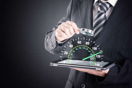 Man hand speedometer in his tablet  in screen close upの写真素材