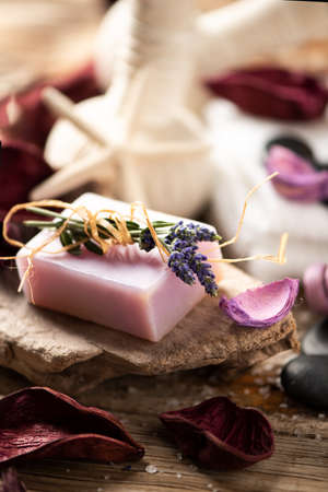 Massage stones, towel, on  wooden surface close upの写真素材