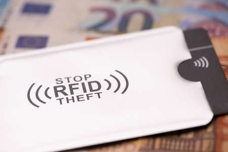 RFID protection sleeve for secure credit card from hacking attack om money banknotesの写真素材