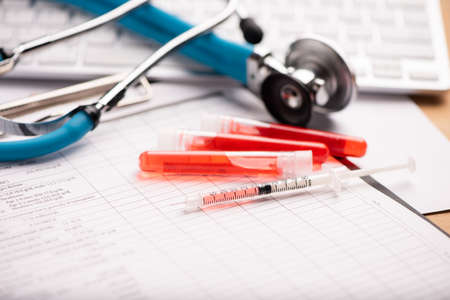 Blood analysis report with lavender color blood sample collection tubes close upの写真素材