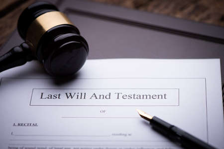 Last Will and testament document on wooden table close upの写真素材