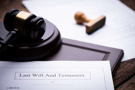 Last Will and testament document on wooden table close upの写真素材