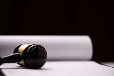 Judge`s gavel with white paper close up