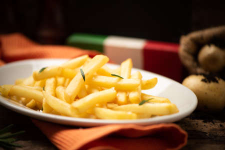 Fresh homemade fries on old wooden table close upの写真素材