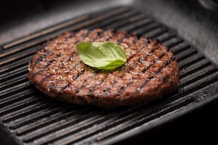 A beef burger grill cooking close upの写真素材