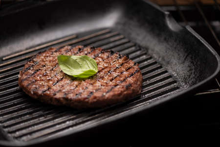 A beef burger grill cooking close upの写真素材