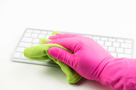 Cleaning  keyboard with micro fibre cloth close up