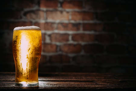 lass beer on a wall background with copyspace の写真素材