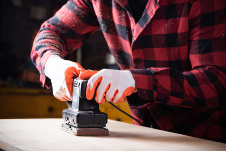 Carpenter, joiner at work in the workshop. Man at work on woodの写真素材