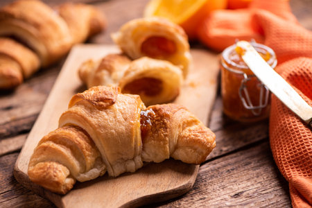 Fresh homemade croissants on wooden table. Close upの写真素材