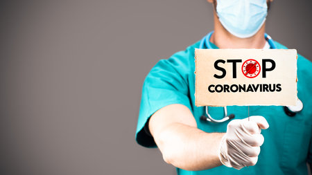 Stop COVID-19 concept.Doctors holding Coronavirus 2019-nCoV Stop signの写真素材