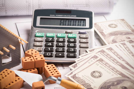 House model on background of US one hundred dollar bills close upの写真素材