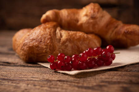 Fresh homemade croissants on wooden table close upの写真素材