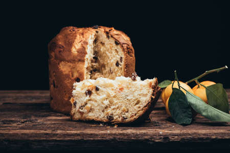 Christmas cake panettone on rustic tableの写真素材