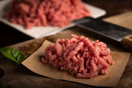 Fresh Minced Meat on vintage wooden background close upの写真素材