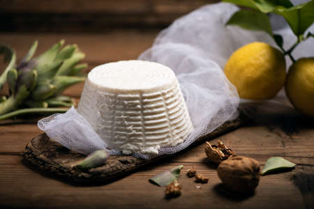 Fresh ricotta cheese on wooden backgroundの写真素材