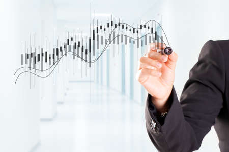 A woman hand drawing Business Growth Graph with marker on transparent wipe board.