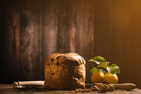Homemade Christmas Even Panettone on a rustic wooden table close up
