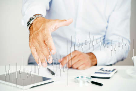 Business man offer and give hand for handshake in office with a growth graphic