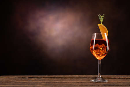An Aperol Spritz with ice on the table close upの写真素材