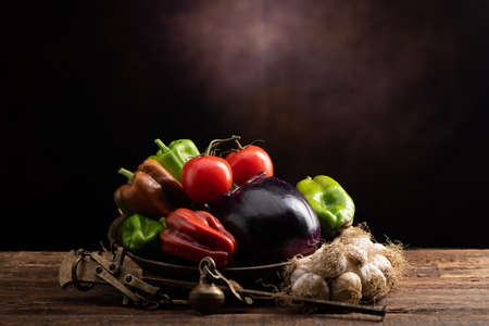 Fresh vegetables displayed for sale on a old scale. Close up of vegetables in a vintage moodの写真素材