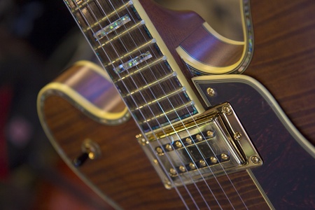 An hollow body electric guitar with color details