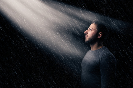 portrait of a sad man and abandoned in the rain