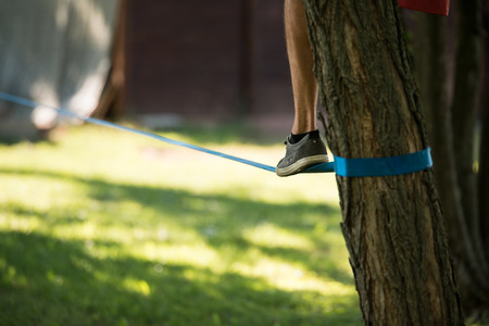Man who came up on Slacklineの写真素材