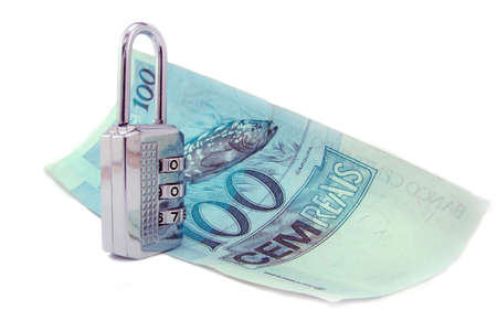 100 real brazilian money and closed padlock isolated on whiteの写真素材