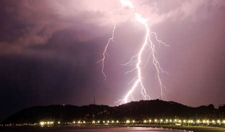 lightning bolt striking the city of santos in brazilの写真素材