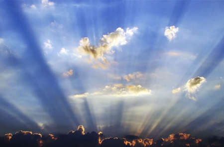 sunrays emerging behind the cloud
