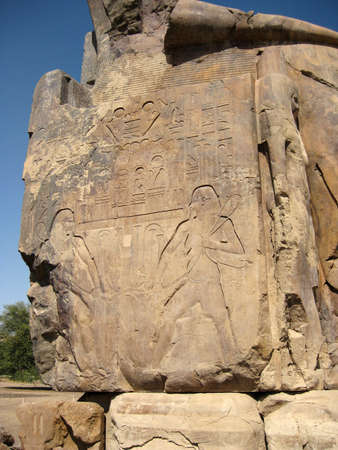 EGYPT Luxor - The side of one of The Colossi of Memnon with inscriptions.