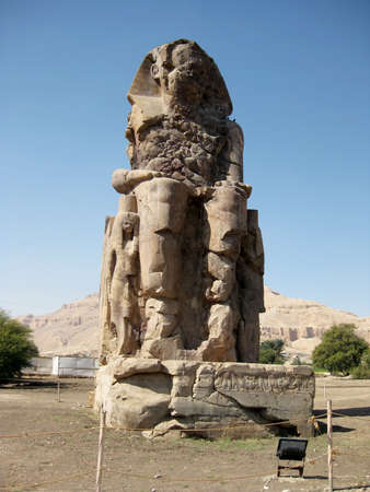 EGYPT Luxor - One of The Colossi of Memnon - two massive stone statues of Pharaoh Amenhotep IIIのeditorial素材