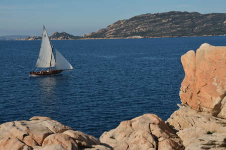 Sailboat sailing in Sardiniaの写真素材