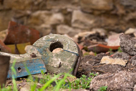 an old object that emerges among the rubble of a ruinの写真素材