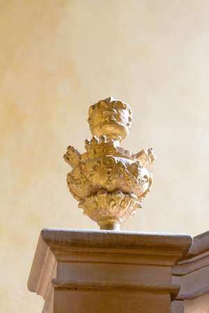 ancient statue on the pillar of a staircaseの写真素材