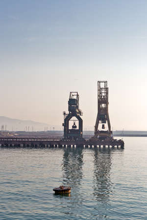 industrial plants in the sea at sunrise